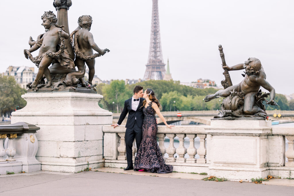 a couple kissing on the pont alexandre iii bridge in Paris