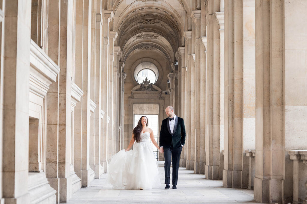 bride and groom together at the Louvre Museum in Paris
