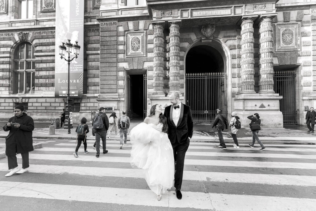 bride and groom walking the streets of Paris on their wedding day