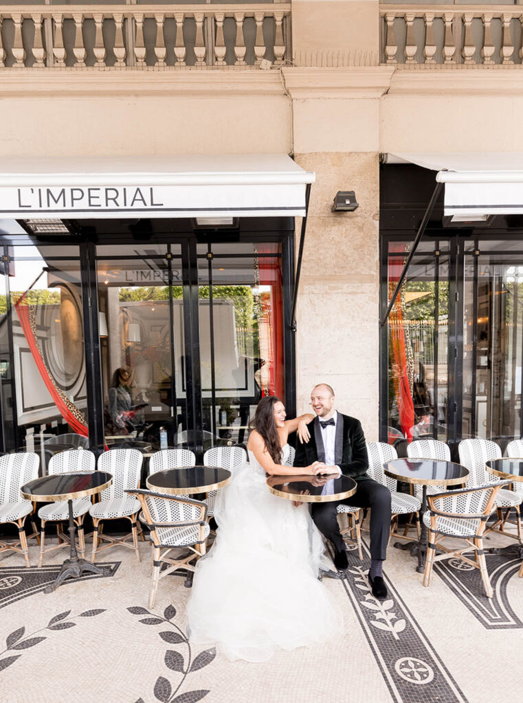bride and groom at a cafe in Paris